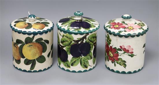 Three Wemyss biscuit barrels in Victoria Plum, Seville orange and apple blossom patterns height 15cm